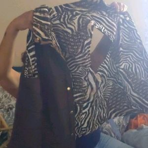 A reversible brown and animal print vest